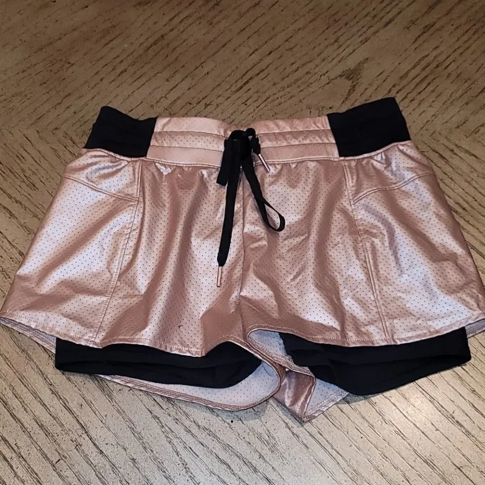 Cala by Carie Underwood 2 in 1 Rose gold shorts XS